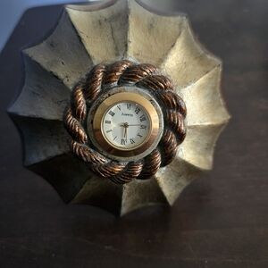 Umbrella Desk Clock Quartz Resin Measures: 4 3/4" L. x 4 1/2" diameter.